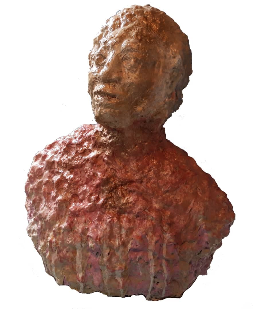 urn of a bronze statue with a face and head, set against a white background
